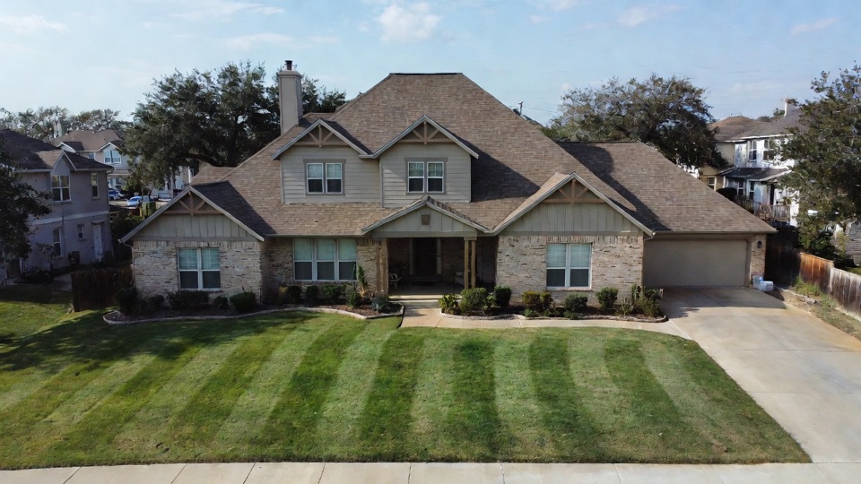 Striped lawn and full property maintenance in Forney