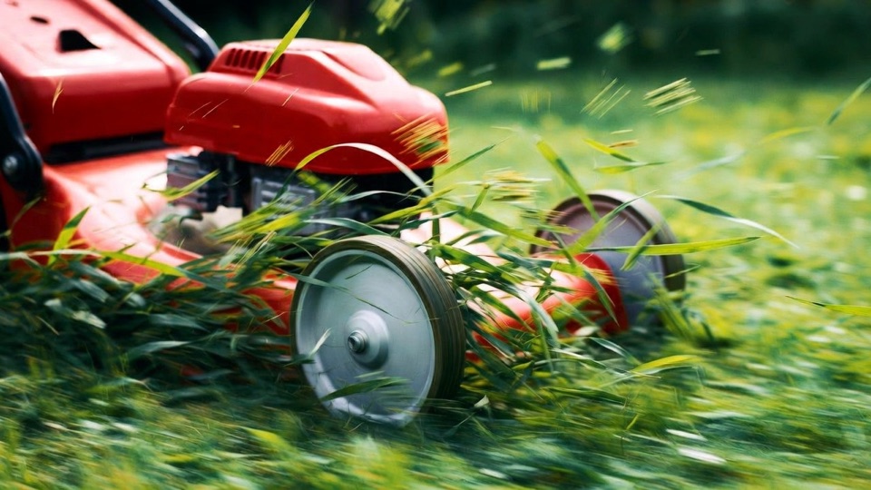 Robert Sibrian Lawn Care mowing a residential lawn